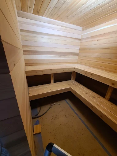 Cedar sauna bench framing during a basement sauna build