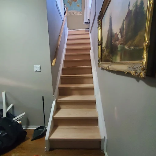 New hardwood staircase treads and risers installed in a Durham Region home