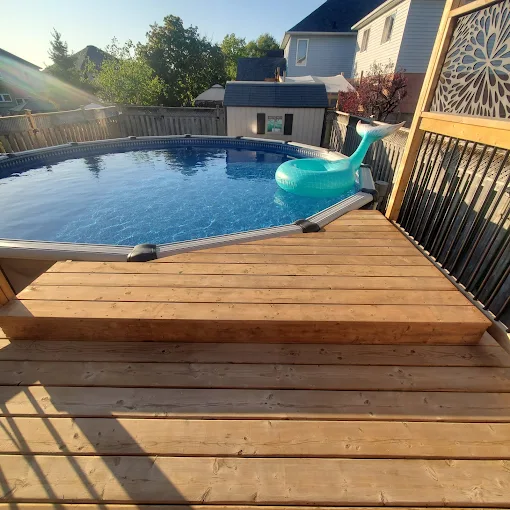 Wrap-around pool deck built around an above-ground pool in Durham Region