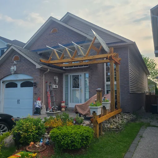 Timber front entry pergola under construction on an Oshawa home
